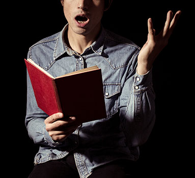A boy reading a script