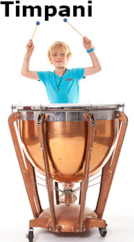 a boy playing a timpani