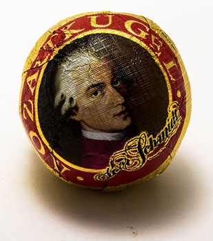 A piece of candy with Mozart's image on the wrapper