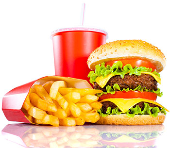 fast food meal of a burger, fries, and a drink